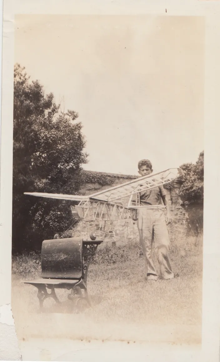 Norman Mailer with a model airplane, 1937