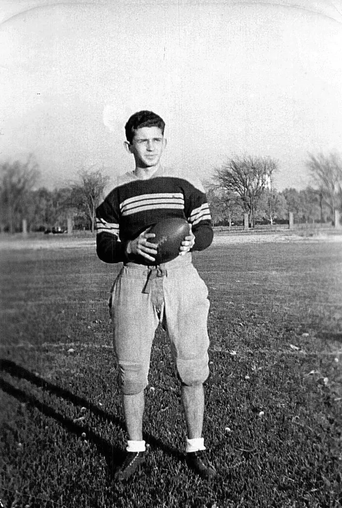 Norman Mailer in a football jersey, 1941