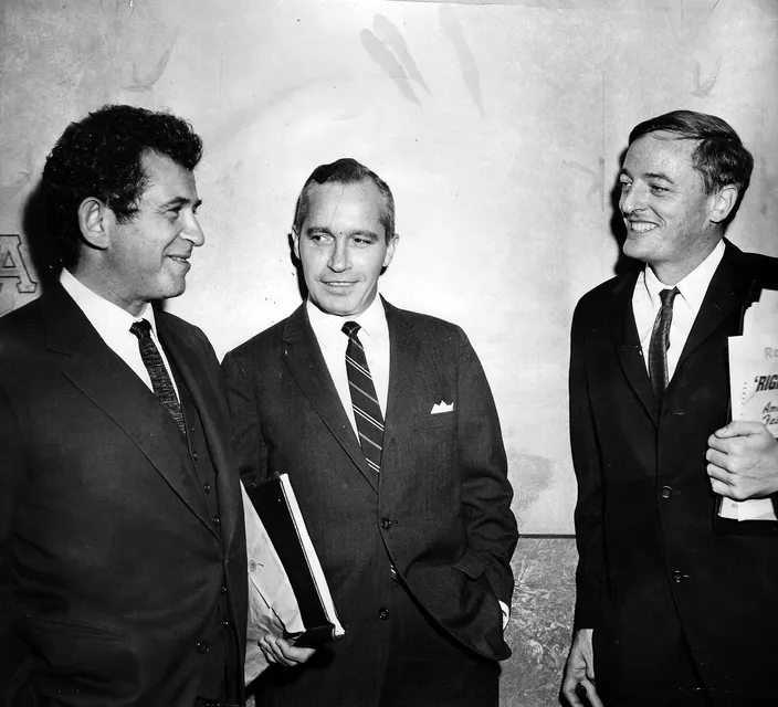 Mailer, Frank Reynolds, and William F. Buckley Jr. at the 22 September 1962 Chicago debate (N.Y. Daily News)