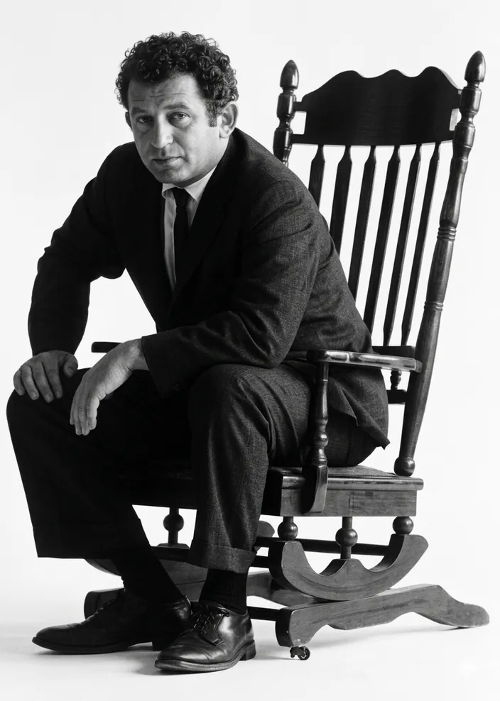Jacket photograph of The Presidential Papers (Putnam's, 8 November 1963): Mailer in the JFK-style Boston rocking chair